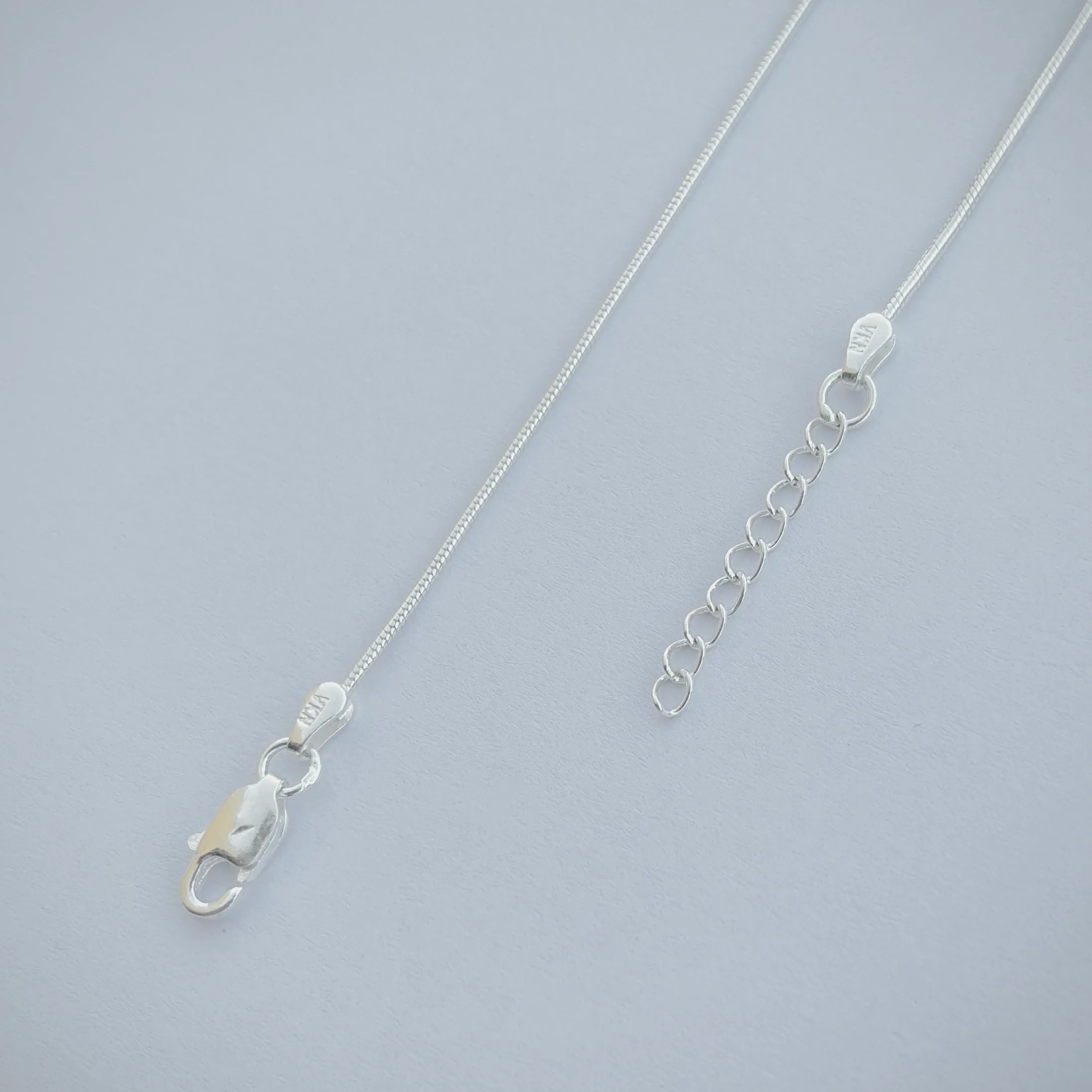 Delicate Silver Anklet with Light Purple Moti and Silver Accents.