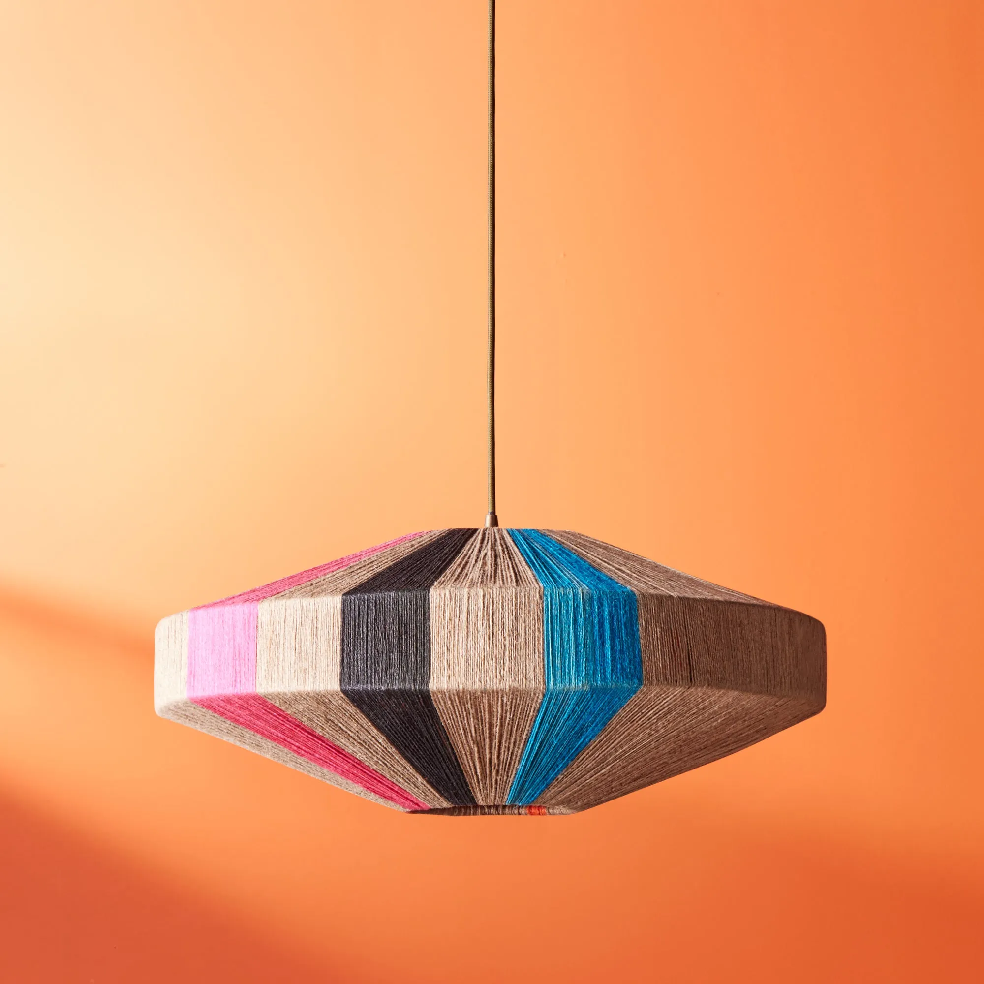 Harlequin pendant in natural, black, pink and orange