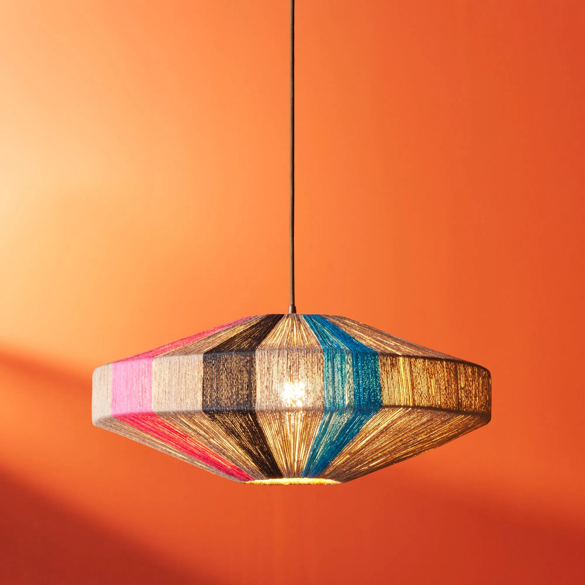 Harlequin pendant in natural, black, pink and orange